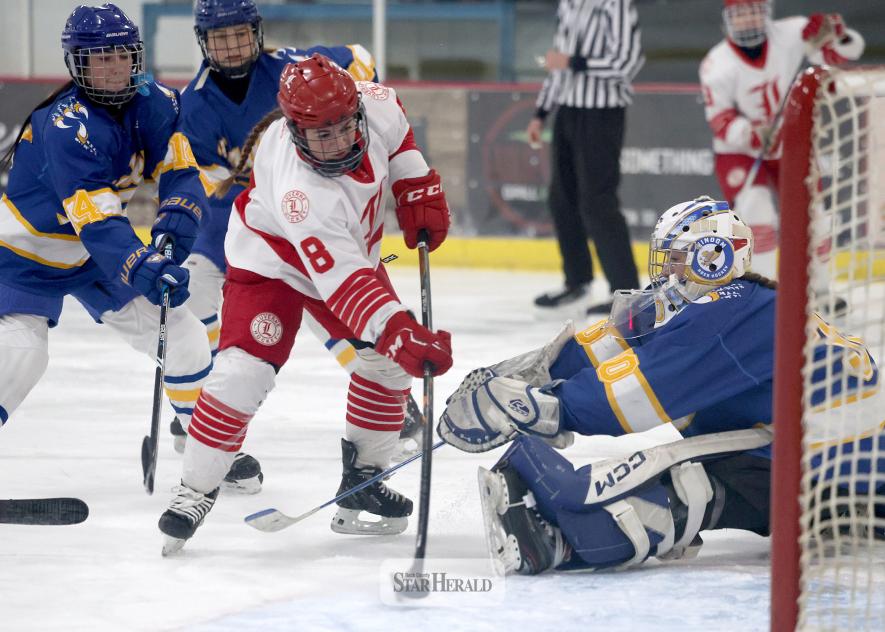 Greg Hoogeveen photo/LHSGHOC1 LHS senior Ella Apel works the puck around Windom’s goalie for her second goal of the game. Apel finished with two goals and two assists in the 8-0 win over Windom Dec. 16 in Luverne.