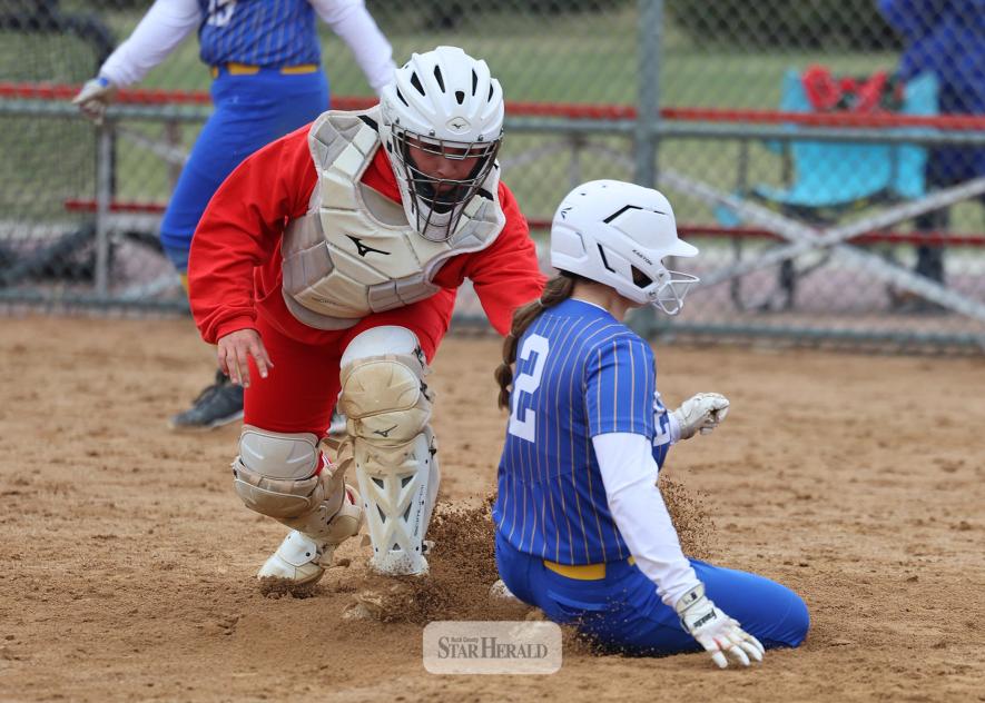 Greg Hoogeveen photo/LHSsoftball1 LHS senior catcher Jordyn Reisch makes a tag at home for an out against Esko Saturday, April 11, in Luverne. Luverne fell 14-7 in the game to a strong Esko girls’ team.