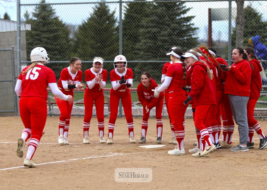 LHS junior Jocelyn Altman, No. 15, heads to home plate with her teammates waiting to congratulate her after hitting a home run against Windom Thursday, April 10, at home. LHS beat Windom 8-6 in the game.