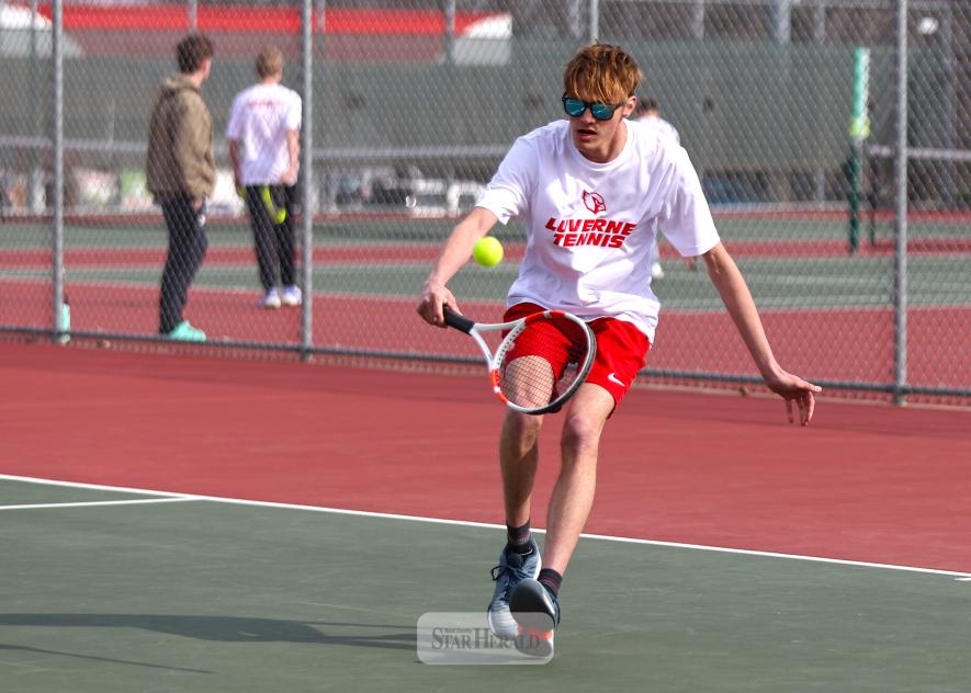 LHS senior Kaleb Hemme approaches to return a shot from his Worthington opponent Tuesday, April 8, at the tennis meet in Luverne. Hemme won the No. 1 singles match, but Luverne fell 6-1 to the Trojans.
