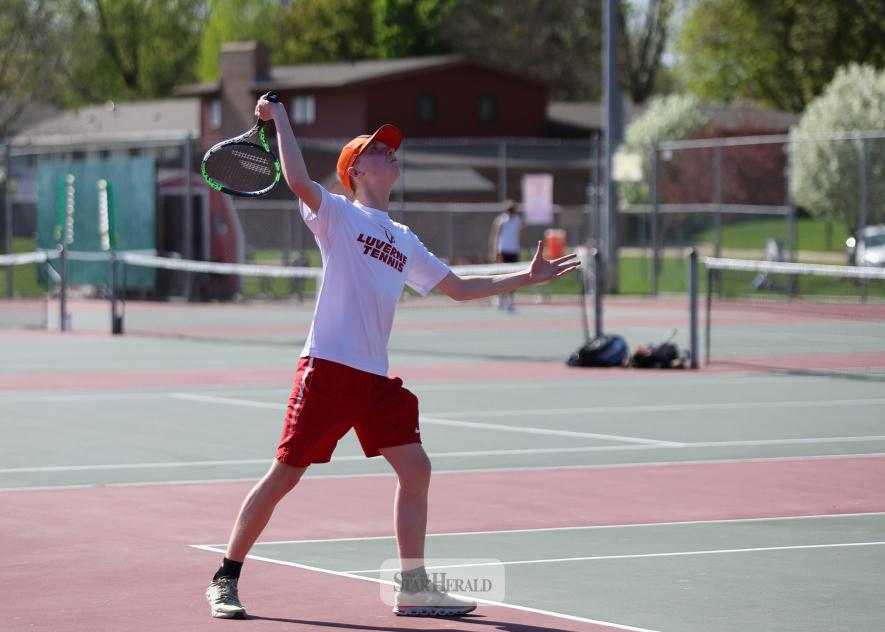 Luverne junior Elijiah Henrichs serves to his Blue Earth opponent in the No. 4 singles match May 6 at home. Luverne fell 7-0 to the Buccaneers in the meet.
