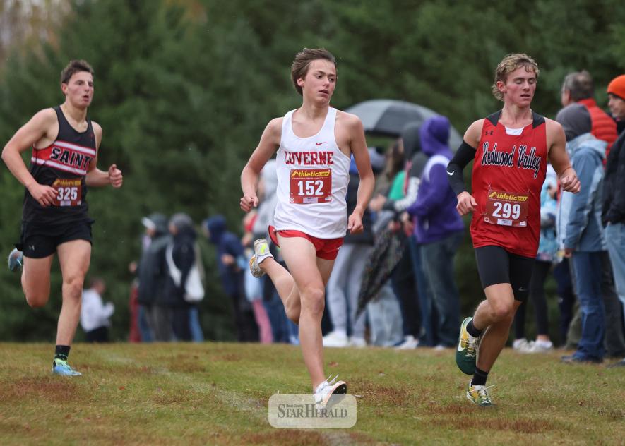 LHS junior Marcus Papik fights for position heading into a sharp turn in cross country action in Luverne Tuesday, Oct. 14, in the Big South Championships. Papik finished in sixth place in the small school varsity 5,000-meter race.