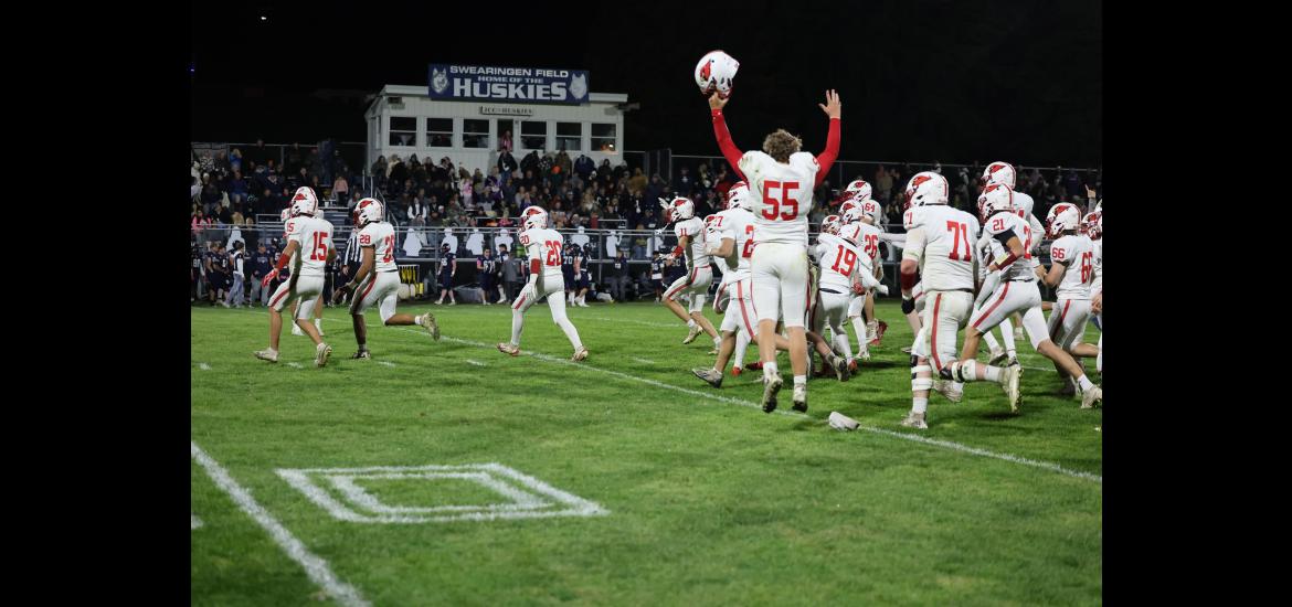 Luverne players rush the Huskies’ field after beating Jackson County Central 36-30 in Week 7 action.