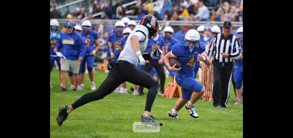 Greg Hoogeveen photo/A-EFB1 Adrian-Ellsworth running back junior Jackson Jenniges finds a lane along the sidelines against Edgerton at home Friday, Sept. 25. The Dragons beat the Flying Dutchmen 22-20 in the homecoming game. Jenniges finished with 105 rushing yards and one TD.