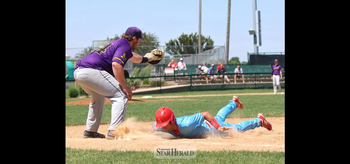 Braydon Ripka dives back into first base safely as Pipestone tries to pick him off at first. Luverne blanked Pipestone 12-0 at home Sunday, June 16.