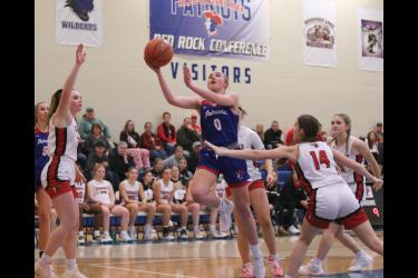 Patriot sophomore Abbie Harris drives the lane against Dell Rapids for a layup Friday, Dec. 29, at home. H-BC won the game against the Cardinals 79-50 during the holiday break.