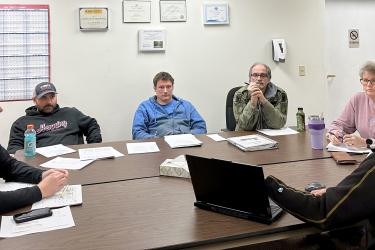 Engineer Blayne Parkos (far right) discusses water options for the new Hills-Beaver Creek Elementary School with the Beaver Creek City Council (from left) Mayor Josh Teune and council members Cody Dietrich, Jacob Conger, Alan Harnack and Heidi Freese during the Wednesday night, Jan. 10, meeting in Beaver Creek City Hall. Lori Sorenson/Rock County Star Herald Photo
