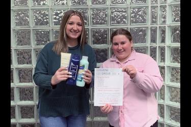 Madi Wenzel (left) holds examples of hygiene products she and her partner, Mallie Fick, need donated toward their hygiene drive. The pair is seeking 250 items to distribute through the Rock County Food Shelf. Mavis Fodness/Rock County Star Herald Photo