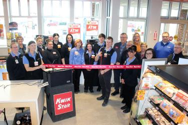 A Luverne Area Chamber ribbon-cutting took place Feb. 21 at the Luverne Kwik Trip location. Luverne store leader John Espe (center with scissors) cut the ceremonial ribbon. Pictured are (from left) Kristina Schott, Jane Lanphere, Patty McClain, Zoe Zek, Breanna Hofland, Syndal Pick, assistant store co-leader Courtney Rierson, assistant store co-leader Cortney Pavelko, Mary Cramer, Kristofer Aanenson, John Espe, Pat Baustian, Scott Zietlow, Crissy Reverts, Amber Lais, Nancy Scheidt, 