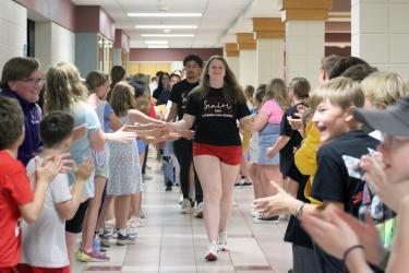 Morgan Ahrendt and JJ Shelton lead the Class of 2024 through the elementary cafeteria, where they were congratulated by fifth-graders. Mavis Fodness/Rock County Star Herald Photo