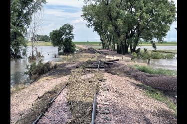 An estimated $900,000 in flood damage occurred along the Buffalo Ridge Regional Railroad (BRRR) in Nobles and Rock counties during the late June weather event. Repair costs (including the section pictured above, west of Magnolia) will be covered by the federal government, as the railroad is owned by the two counties. To speed repairs along, commissioners in Rock and Nobles counties agreed July 2 to split the estimated repair costs and later submit the final cost to FEMA for reimbursement. Submitted Photo