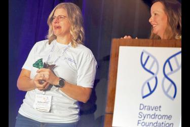 A teary-eyed Heather Johnson (left) accepts the Ciara’s Spirit of Hope Award from Lori O’Driscoll on June 21 at the Dravet Syndrome Foundation conference in the Twin Cities. Submitted Photo
