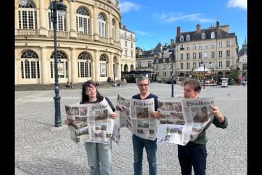 (From left) Emilie Rivalin, Patrick Rocher and Christophe Cocherie take a break recently in Rennes, France, to read about their project in the June 13th edition of Rock County Star Herald.  Submitted Photo