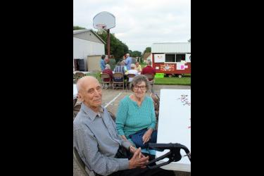Albert and Frances Haak attend the Schoolyard Celebration for the 75th anniversary of Hills Christian School Monday evening. In 1949, Albert, an eighth-grader, was the first graduate of the school. Frances graduated in 1952. Mavis Fodness/Rock County Star Herald Photo