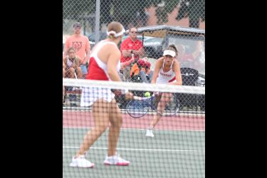 Junior Augusta Papik hustles to return a low shot in her doubles match Thursday, Sept. 7, in Luverne.