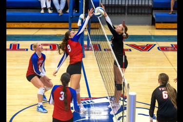 Greg Hoogeveen photo/0917HBCVB1 Patriots senior Ava Steinhoff, No. 9, fights for a free ball over the net against Viborg-Hurley Sept. 10 at home. The Patriots beat the Cougars in three straight sets in their first home match.