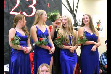 Grace Anderson (third from left) reacts as last year’s homecoming queen, Taylor Huisman, places a crown on her head. Pictured (from left) are Sylvia Fick, Avril Susie, Anderson and Taylor Gehrke. Mavis Fodness/Rock County Star Herald Photo