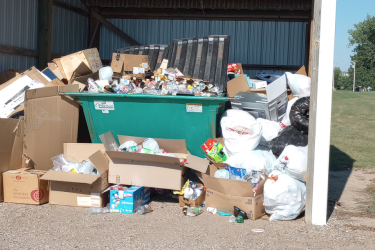 This photo of the Beaver Creek rural recycling shed was taken two weeks ago. It illustrates the perpetual state of overflowing materials that often find their way into neighboring city yards and properties. Submitted Photo
