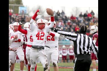 LHS senior Conner Connell lifts the ball after falling on a fumble by Fairmont in the first half. Luverne fell to Fairmont 32-0 in Section 3A semifinal action on the road Saturday, Oct. 28.