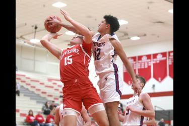 Rock LHS senior Gavin DeBeer goes up for a shot and H-BC sophomore EJ Wegener gets his hand on the ball and DeBeer for a foul Tuesday, Dec. 5. The Patriots beat the Cardinals 77-65 at home.County Star Herald Photo