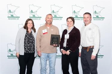 Rock County’s Soil and Water Conservation District received the Minnesota Drinking Water Protection Award during the Minnesota Association of Soil and Water Conservation Districts annual conference in Bloomington on Dec. 1-3. Rock County Land Management Assistant Director Arlyn Gehrke (second from left) accepted the award on behalf of his office. Pictured with him are (from left) Amanda Strommer, principal drinking water protection planner with the Minnesota Department of Health; Myra Kunas, asShared Image 