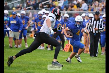 Greg Hoogeveen photo/A-EFB1 Adrian-Ellsworth running back junior Jackson Jenniges finds a lane along the sidelines against Edgerton at home Friday, Sept. 25. The Dragons beat the Flying Dutchmen 22-20 in the homecoming game. Jenniges finished with 105 rushing yards and one TD.