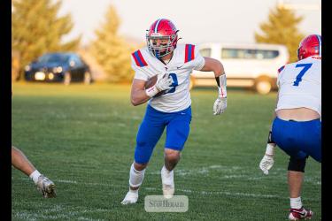 Samantha McGaffee photo/HBCFB1 Patriots junior Max Sammons runs through a hole in the Cougars defense Oct. 20 in Cedar Mountain. H-BC won 46-0.