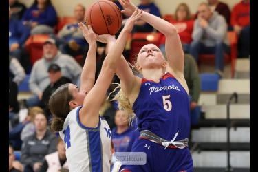 Greg Hoogeveen photo/HBCGBB1 H-BC junior Brynn Bakken reaches for a backet heavily guarded by a West Lyon player Monday, Jan. 26, at home. H-BC fell 62-48 in the game.