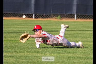 Luverne Junior Legion Red center fielder Ty Kopp dives for a ball during his team’s loss to Marshall Orange at Redbird Field June 11. Junior Legion Red won one game before losing four in a busy week of baseball action. (Greg Hoogeveen photo/0618 junior legion)