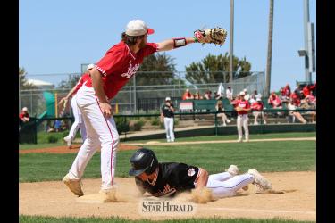Senior Will Serie tries to tag a Marshall player on a pick-off play Saturday, May 18, at Redbird Field. Luverne lost the Big South Conference championship game 10-4 to Marshall.
