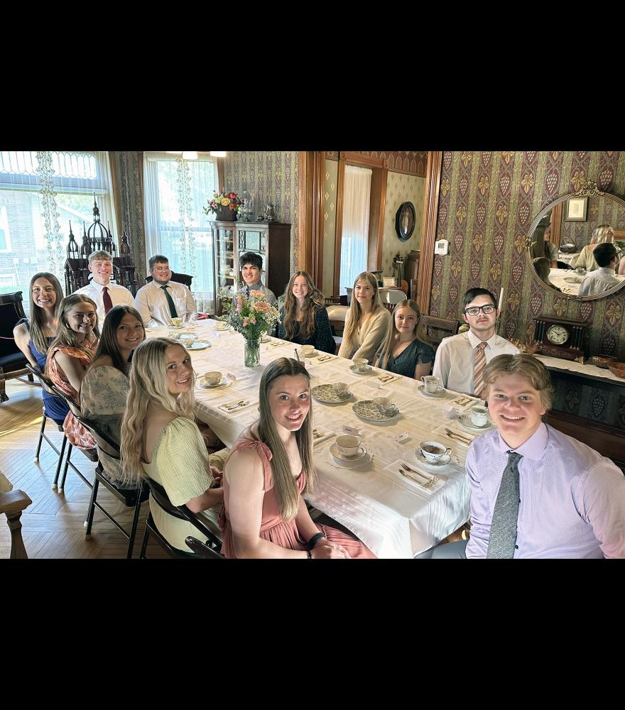 The Class of 2024 Southwest MN CEO students include (clockwise from the foot of the table) Alex Schlosser, Amira Cowell. Kylie Vander Lugt, Maria Rops, Sarah Stegenga, Kiesli Smith, Riley Tatge, Christopher Amundson, Makhi Winter, Taylor Post, Joy Taubert, Harli Rozeboom and Malyki Little. The group assisted Joy Taubert at the Hinkly House Friday morning as she debuted her business, Sip of Joy. Missing is Hailey Boll.